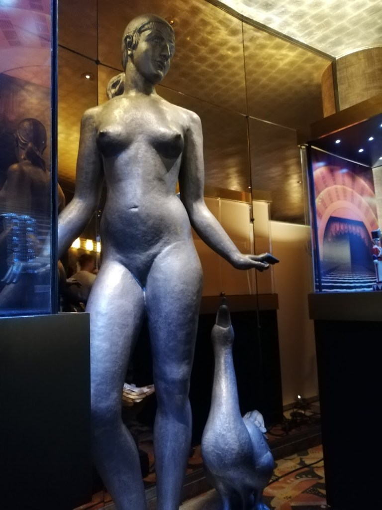 Statue of woman and bird in Radio City Music Hall.